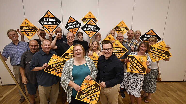 lib dems holding orange diamonds
